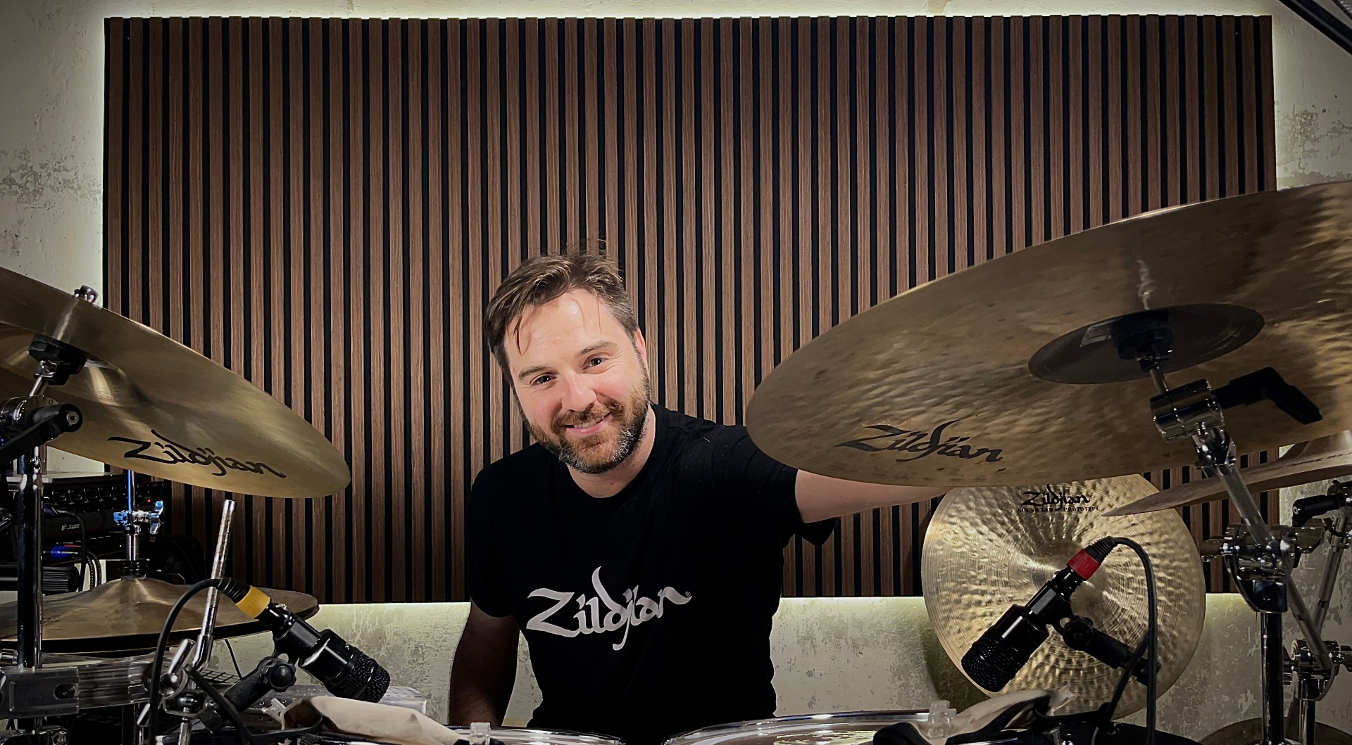 Gonzalo behind the drum kit with Zildjian cymbals